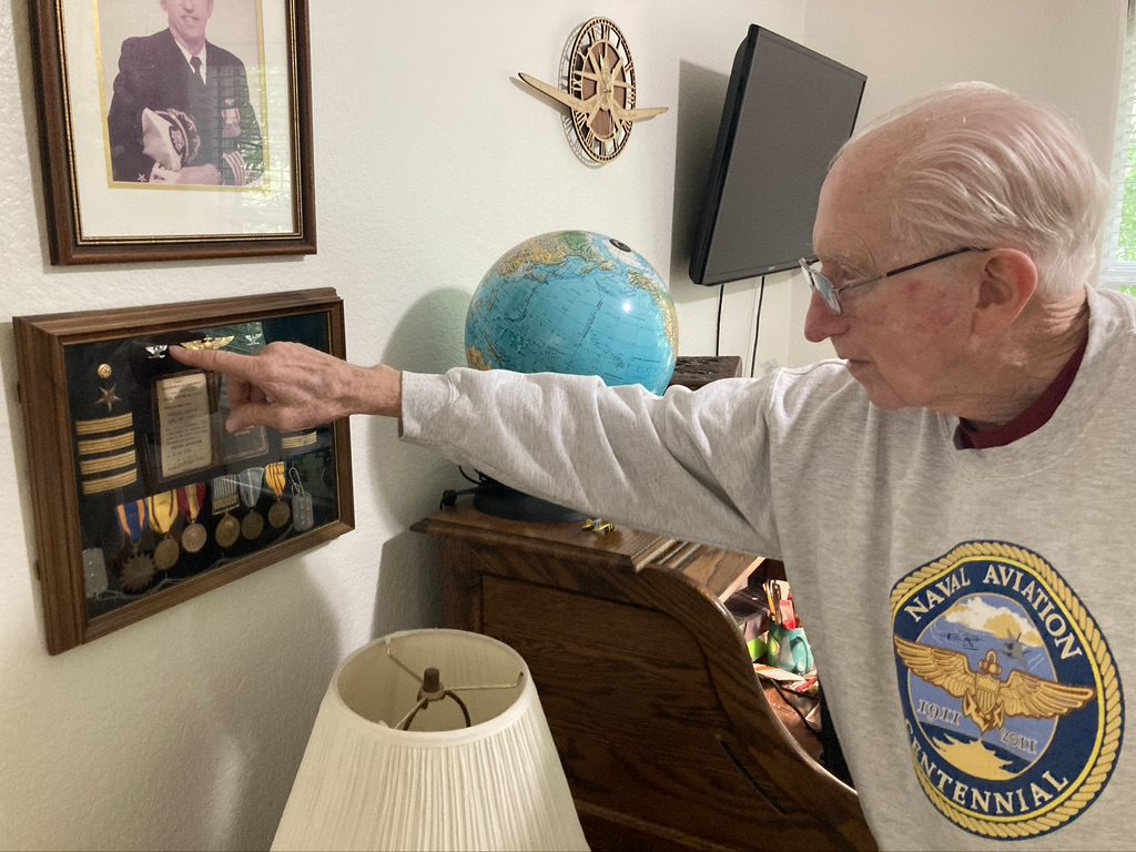 Detwiler points out his air medals and photographs from his time in the reserves. Detwiler points out his air medals and photographs from his time in the reserves.