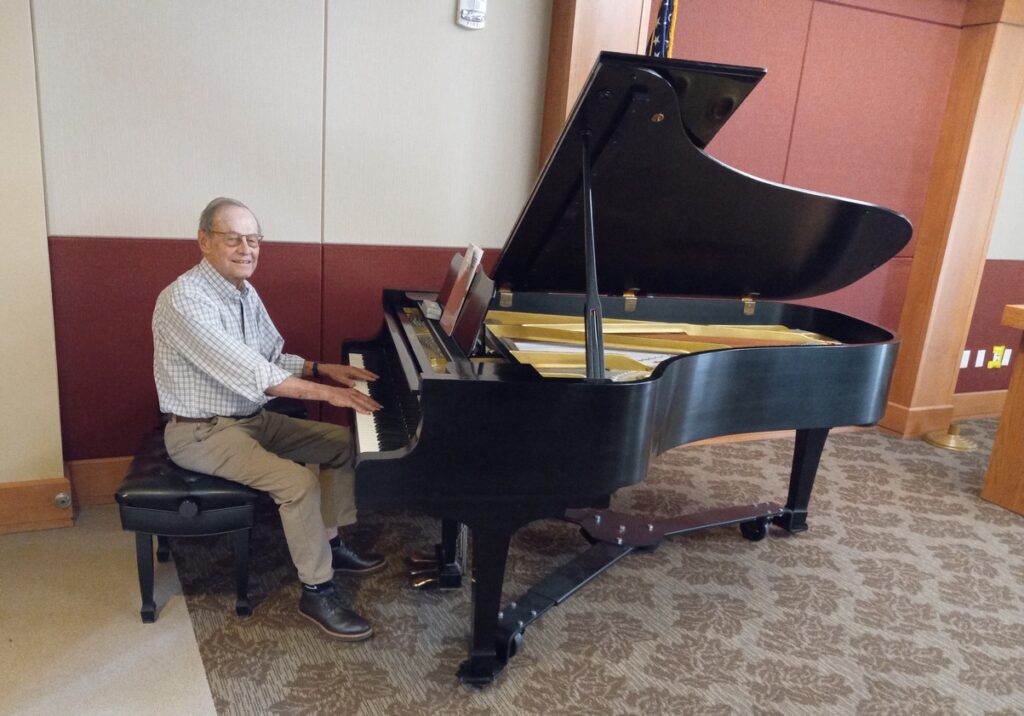 Freese plays the baby grand he donated to Holly Creek Freese plays the baby grand he donated to Holly Creek