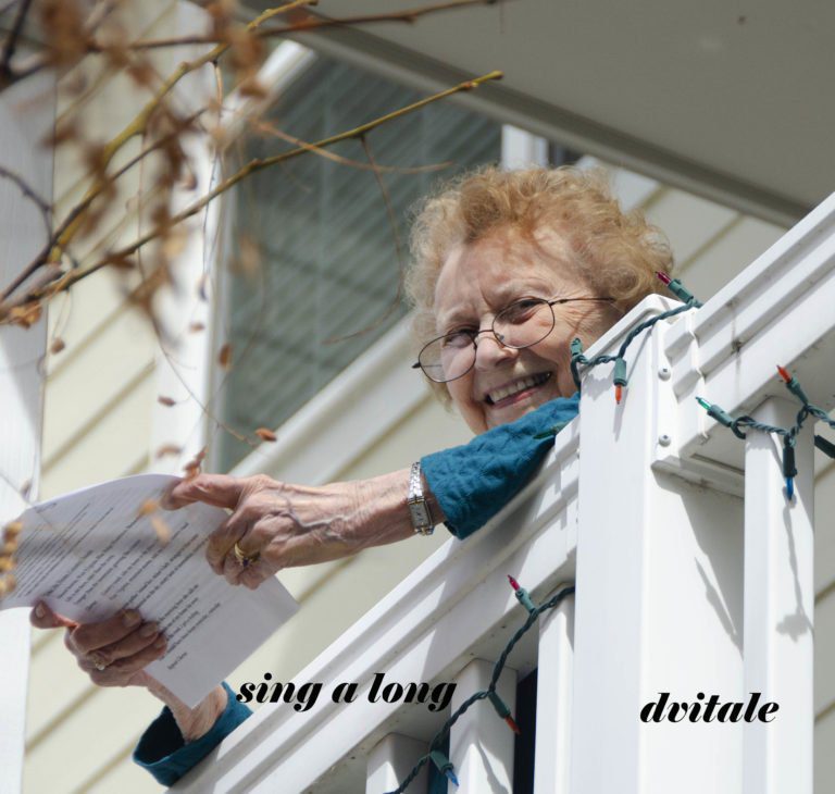 Holly Creek residents participate in the sing-a-long from their balconies. Holly Creek residents participate in the sing-a-long from their balconies.