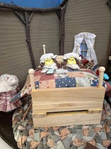 Peeps sleeping under their handmade quilt