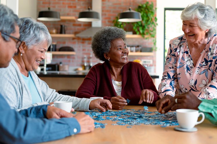 group of active older adults working on a puzzle