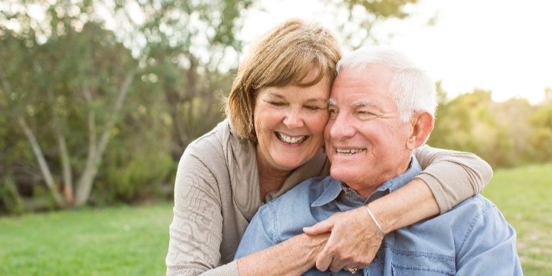 older couple in park landscape