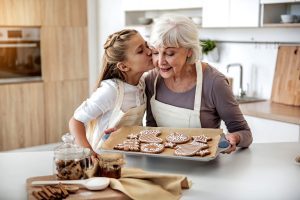 happy child thanking grandma for sweet pastry happy child thanking grandma for sweet pastry